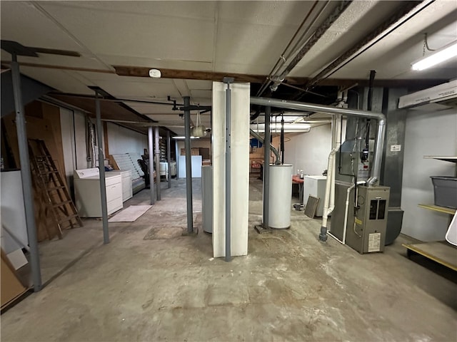 basement with separate washer and dryer, heating unit, and water heater