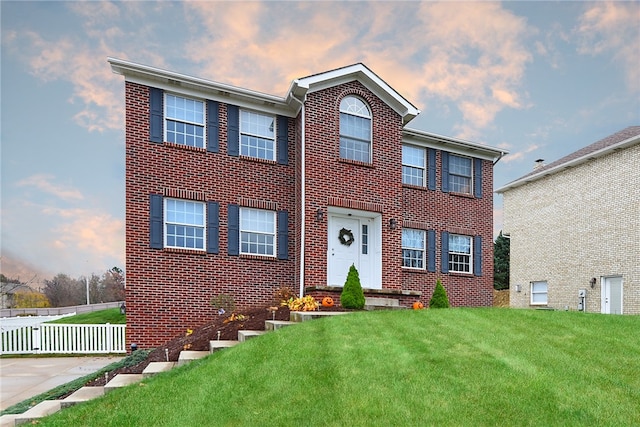 view of front of house with a yard