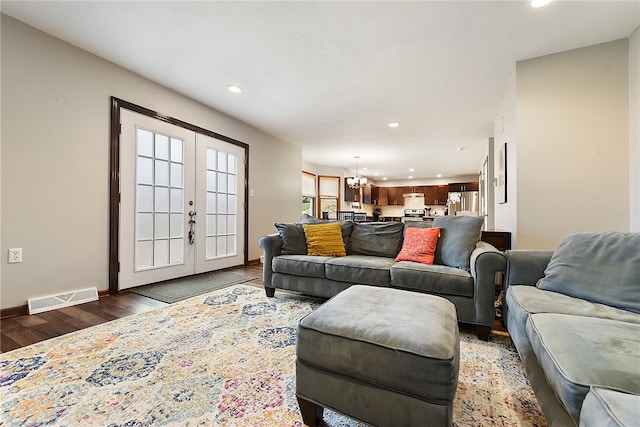 living room featuring french doors and dark hardwood / wood-style floors