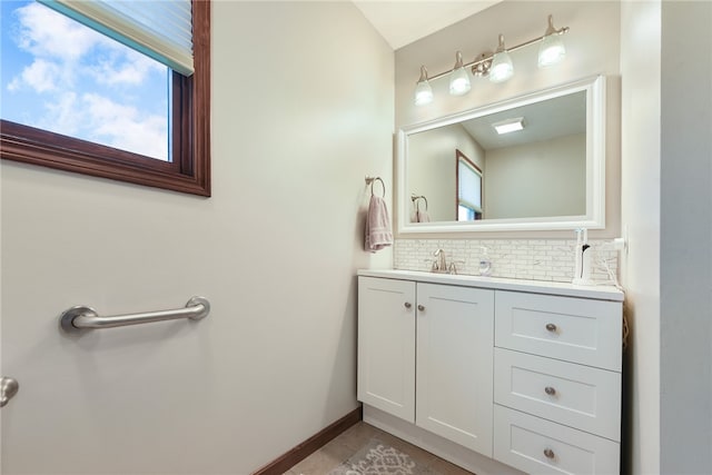 bathroom featuring vanity, backsplash, and tile patterned flooring