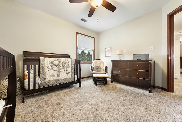 carpeted bedroom featuring ceiling fan and vaulted ceiling