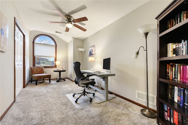 home office featuring carpet flooring, ceiling fan, and lofted ceiling