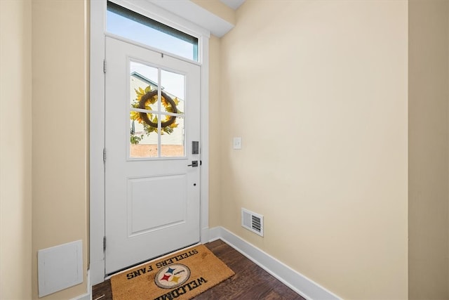 doorway to outside featuring dark hardwood / wood-style flooring