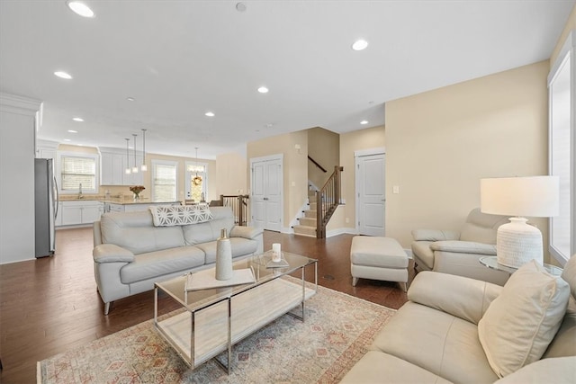 living room with dark hardwood / wood-style flooring