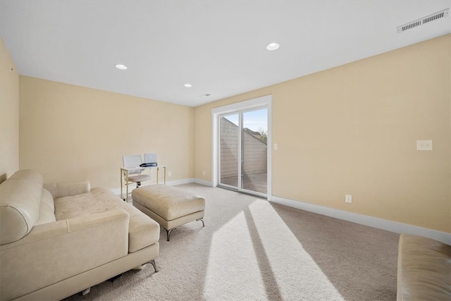 living area featuring carpet floors