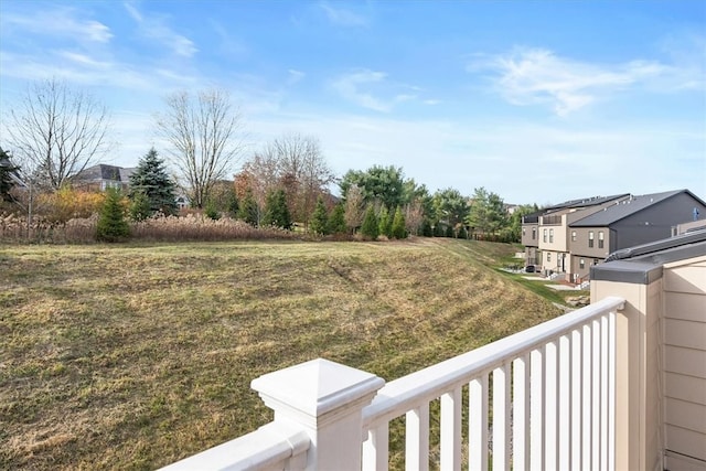 view of yard with a balcony