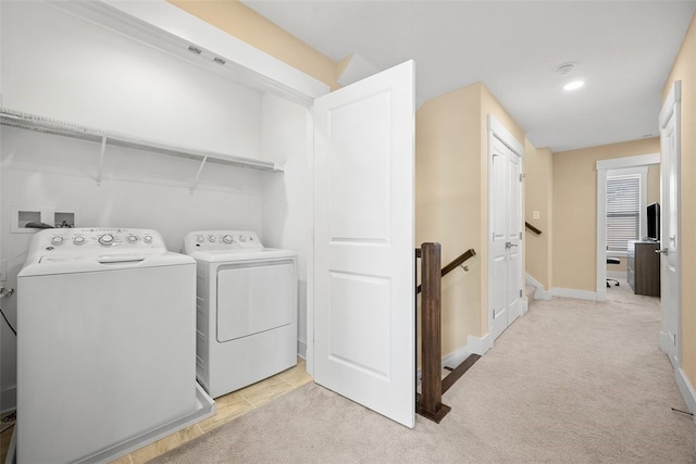 laundry room featuring light colored carpet and washing machine and clothes dryer