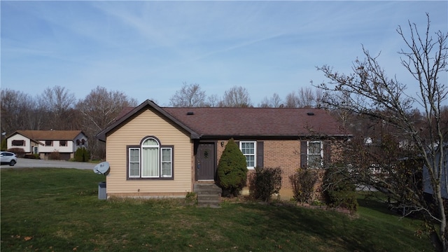 view of front of home with a front lawn