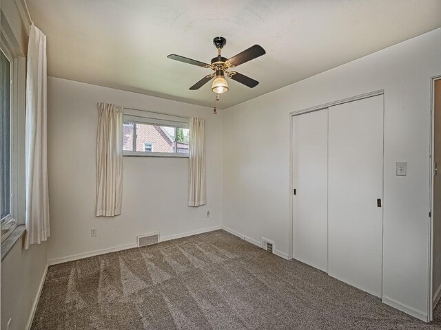 316 Jefferson, Verona, PA 15147 - unfurnished bedroom with carpet, a closet, baseboards, and a ceiling fan