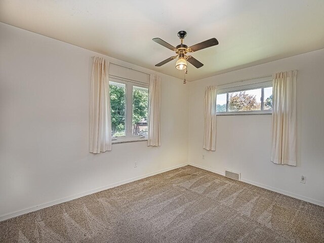 316 Jefferson, Verona, PA 15147 - empty room featuring plenty of natural light, a ceiling fan, carpet, and baseboards