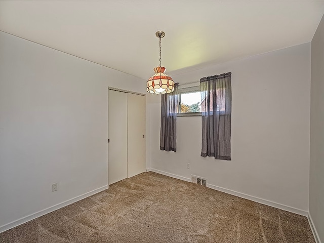 unfurnished room with carpet