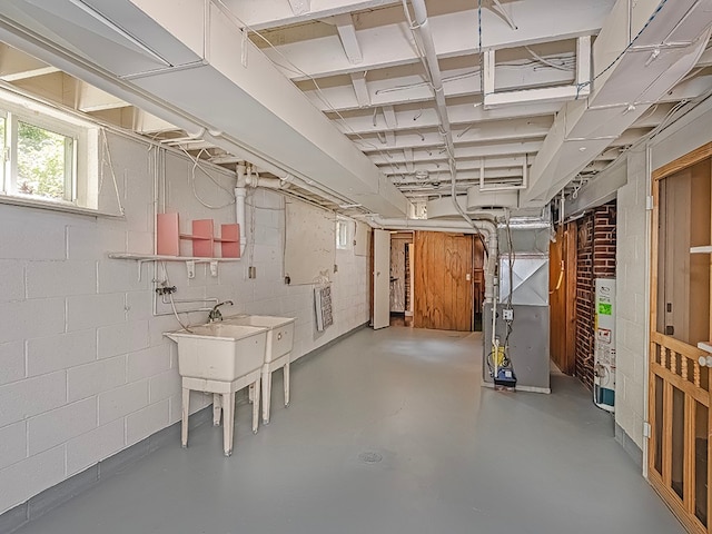 basement featuring heating unit and water heater