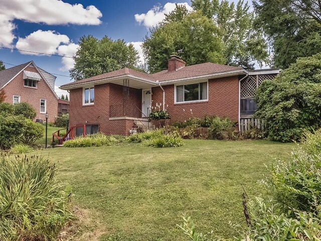 316 Jefferson, Verona, PA 15147 - ranch-style home with a front yard, a chimney, and brick siding