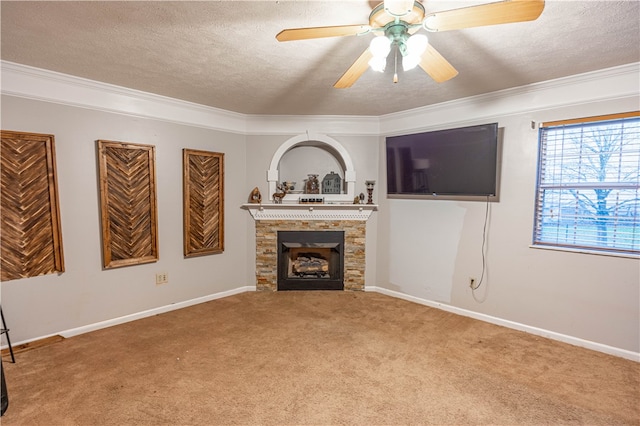 living room with carpet, ceiling fan, crown molding, and a textured ceiling