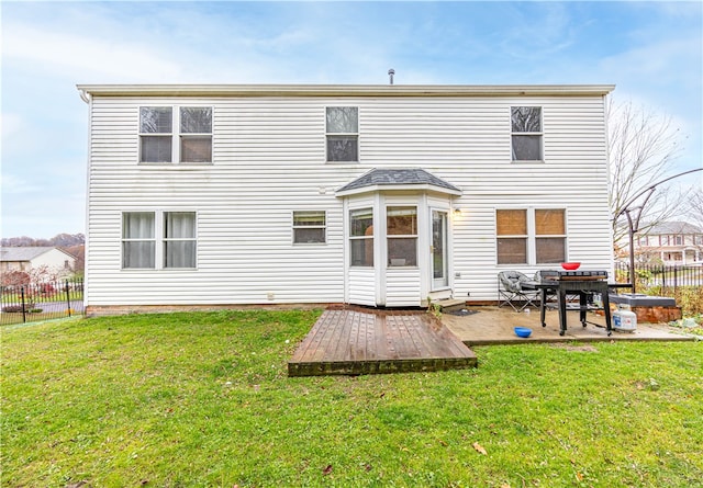 back of house featuring a yard and a patio