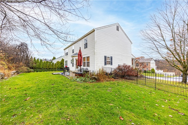 view of home's exterior with a yard and a patio