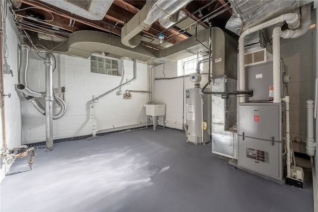 basement with gas water heater and sink