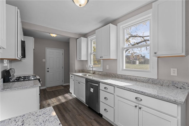 kitchen with white cabinetry, sink, dark wood-type flooring, light stone counters, and stainless steel dishwasher