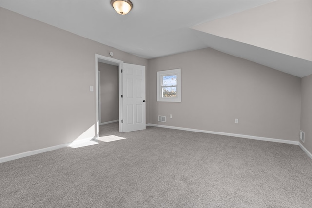 bonus room featuring carpet and vaulted ceiling