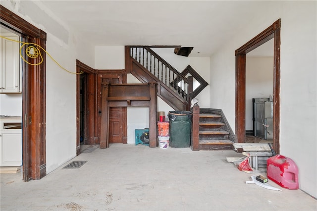 staircase featuring washing machine and dryer