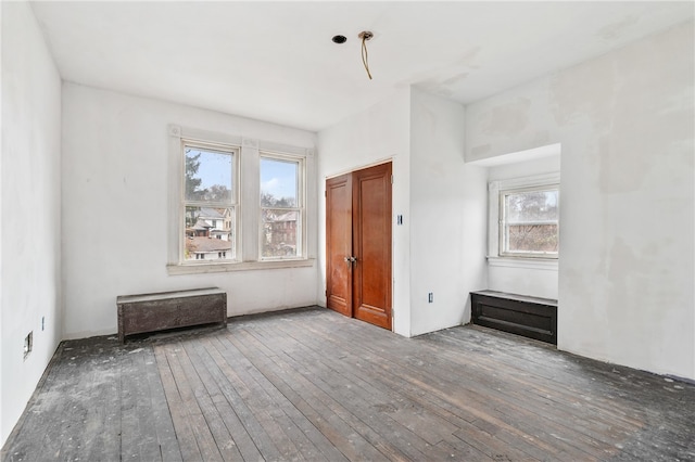 unfurnished room featuring hardwood / wood-style flooring