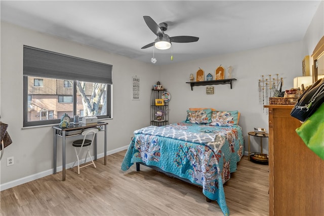 bedroom with hardwood / wood-style flooring and ceiling fan