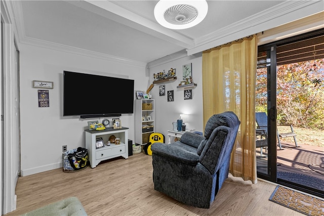 living room featuring hardwood / wood-style flooring and ornamental molding