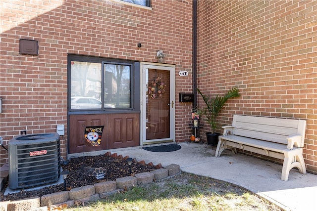 doorway to property featuring central AC unit