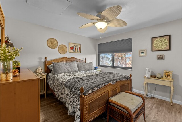 bedroom featuring hardwood / wood-style floors and ceiling fan