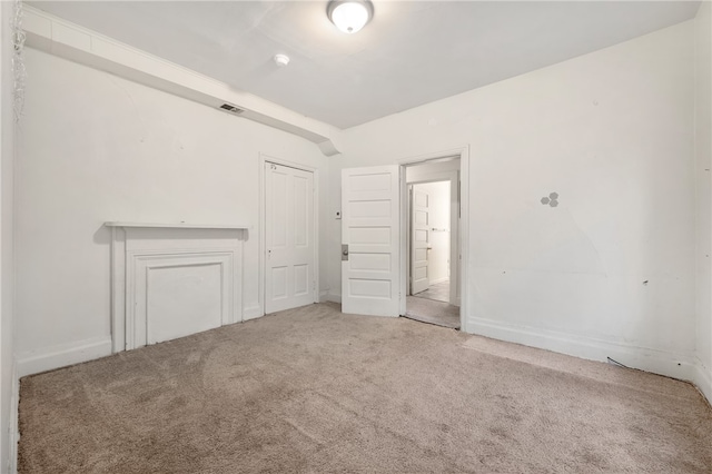 unfurnished room with carpet flooring