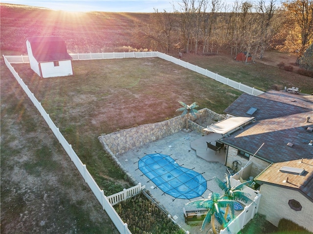 view of yard with a patio area and a covered pool