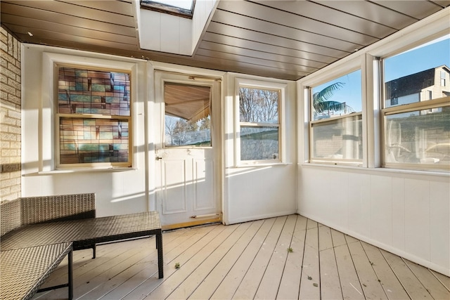 unfurnished sunroom with wooden ceiling