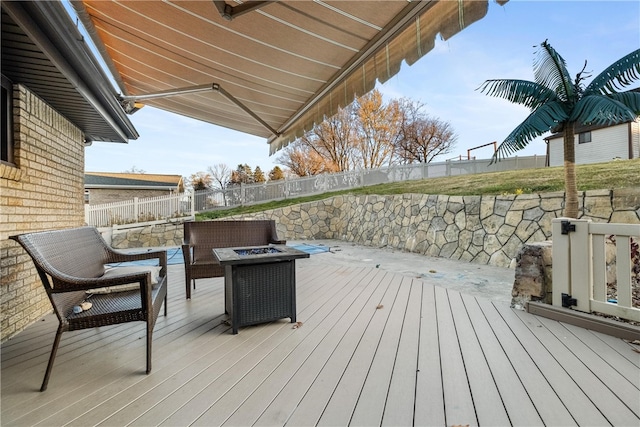 wooden deck featuring a fire pit