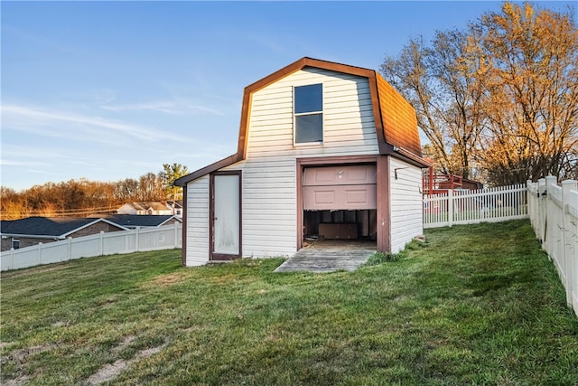 rear view of property featuring a lawn