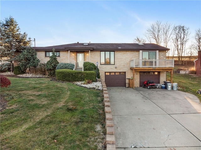 view of front of property with a lawn and a garage