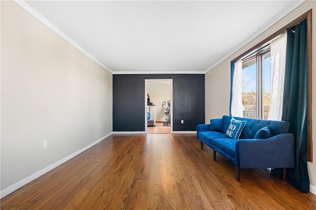 living area featuring hardwood / wood-style floors and ornamental molding