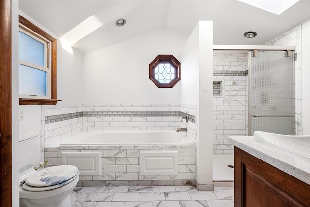 full bathroom featuring toilet, vanity, vaulted ceiling, and separate shower and tub