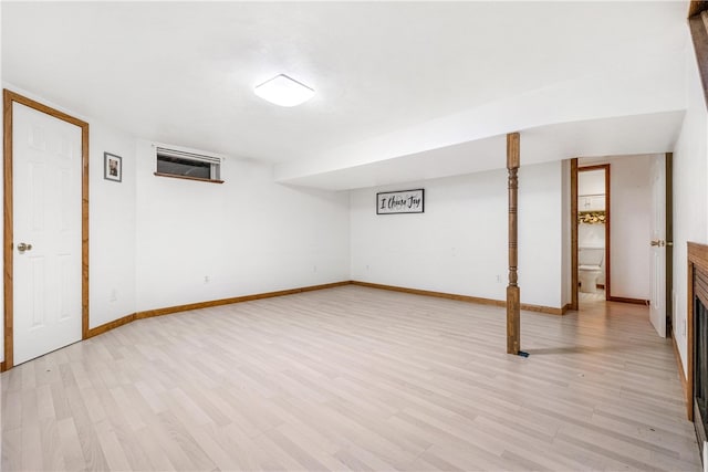 basement featuring light hardwood / wood-style flooring