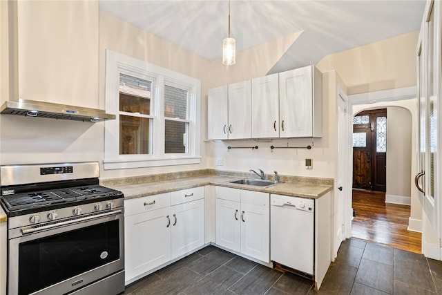 kitchen featuring gas range, hanging light fixtures, dark hardwood / wood-style flooring, white dishwasher, and white cabinets