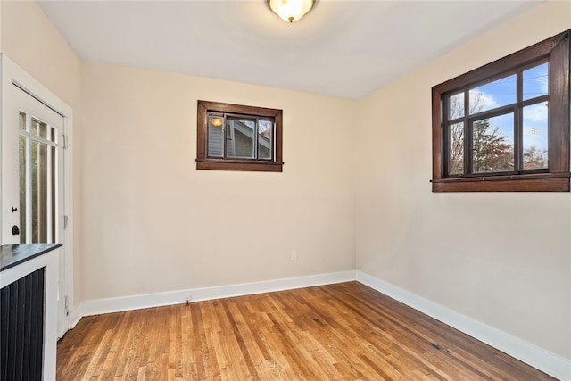 unfurnished room featuring wood-type flooring