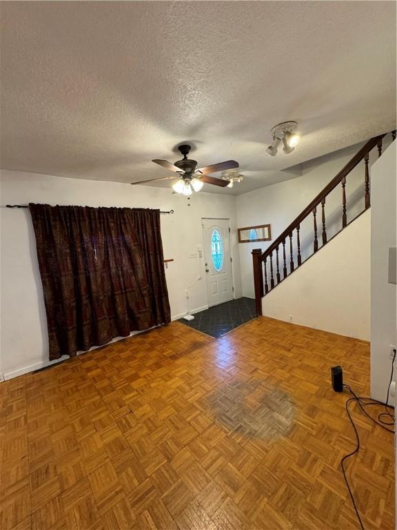3305 Christy St, Sheraden, PA 15204 - foyer featuring a textured ceiling, a ceiling fan, and stairway