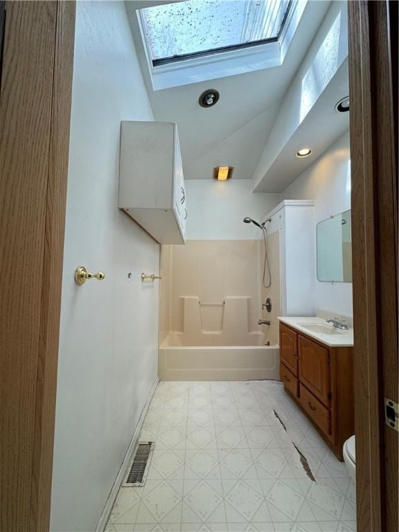 3305 Christy St, Sheraden, PA 15204 - bathroom with a skylight, shower / bathtub combination, vanity, toilet, and tile patterned floors