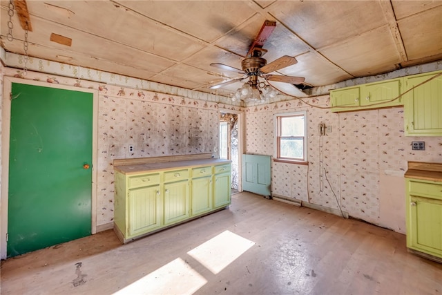 kitchen with ceiling fan and green cabinetry