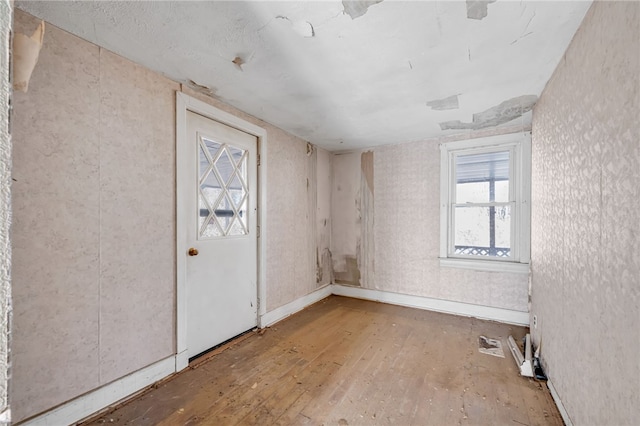 empty room with hardwood / wood-style floors