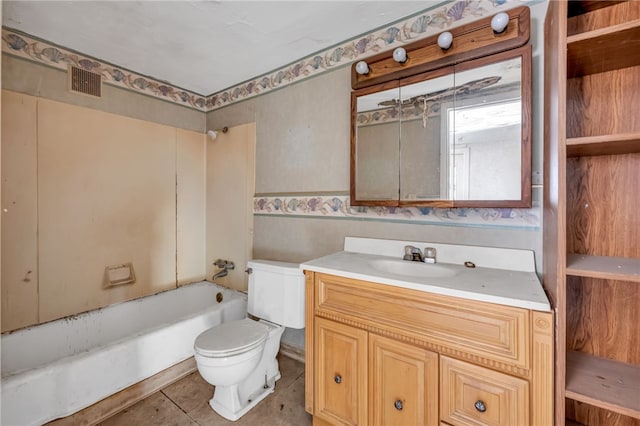 bathroom with tile patterned flooring, vanity, and toilet