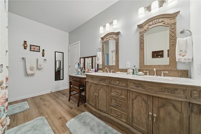 bathroom featuring hardwood / wood-style floors and vanity