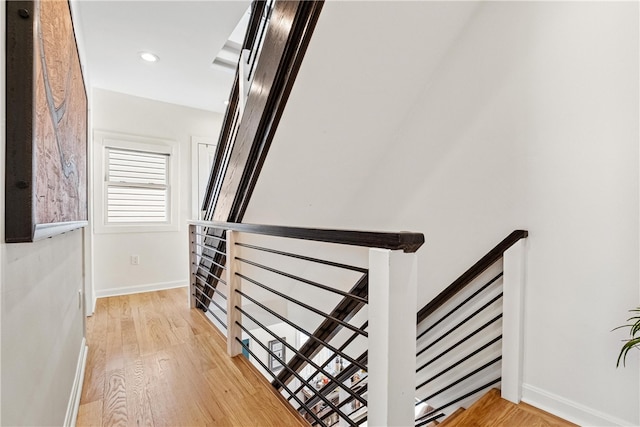 stairs featuring wood-type flooring