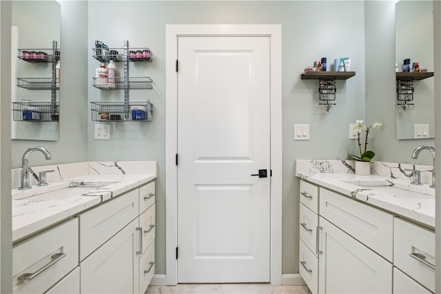 bathroom with tile patterned flooring and vanity