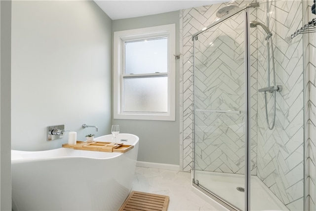 bathroom featuring shower with separate bathtub