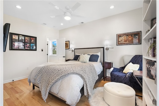 bedroom featuring light hardwood / wood-style flooring and ceiling fan